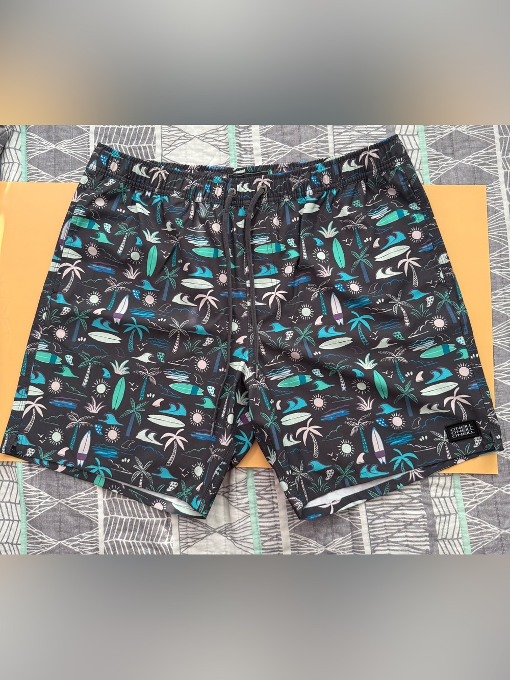 O'Neill Black Swim Trunks with Teal, Mint & Light Pink Tropical Print in Size XL